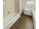 Bathroom featuring a bathtub and a double sink vanity with laminate countertops at 80 Colony Ridge Dr, Alpharetta, GA 30022