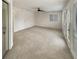 Large bedroom with a ceiling fan, neutral carpet, and great natural light from the sliding glass door at 80 Colony Ridge Dr, Alpharetta, GA 30022