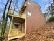 Exterior of a multi-story home featuring private wooden balconies and wooded surroundings at 80 Colony Ridge Dr, Alpharetta, GA 30022