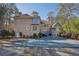 Exterior showcasing backyard pool and spacious home design at 9865 Buice Rd, Alpharetta, GA 30022