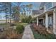 Beautiful stone patio and walkway leading to water feature and a beautiful lake view at 9865 Buice Rd, Alpharetta, GA 30022