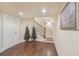 Open basement space with hardwood flooring, neutral walls, and staircase at 9865 Buice Rd, Alpharetta, GA 30022