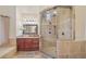 Bright bathroom featuring glass-enclosed shower and vanity with sink, creating a calming atmosphere at 9865 Buice Rd, Alpharetta, GA 30022