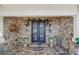 Charming front entrance, with stone detail, double doors, and elegant decor at 9865 Buice Rd, Alpharetta, GA 30022