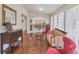 Bright hallway featuring decorative railing and a view of the living area in a neutral palette at 9865 Buice Rd, Alpharetta, GA 30022