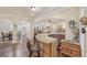 Living room featuring a bar with granite countertops and easy access to the Gathering room at 9865 Buice Rd, Alpharetta, GA 30022