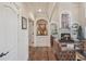 Living room showing arched entryways, fireplace, and hardwood floors at 9865 Buice Rd, Alpharetta, GA 30022