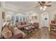 Inviting living room with hardwood floors, arched doorways, and a comfortable seating arrangement at 9865 Buice Rd, Alpharetta, GA 30022