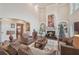 Bright living room featuring a fireplace, built-in shelves, and hardwood floors at 9865 Buice Rd, Alpharetta, GA 30022