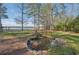 Beautiful rock-rimmed pond with lush landscaping creating a serene outdoor space at 9865 Buice Rd, Alpharetta, GA 30022