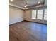 Bright and airy bedroom with tray ceiling, large windows, and hardwood floors at 1055 Dryden Ln # 10, Atlanta, GA 30319