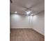 Bright bedroom with wood flooring, a ceiling fan with light, and neutral paint at 1055 Dryden Ln # 10, Atlanta, GA 30319