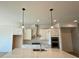 Modern kitchen with white cabinets, stainless steel appliances, a center island with a sink, and decorative pendant lighting at 1055 Dryden Ln # 10, Atlanta, GA 30319