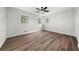 Bright bedroom featuring three windows and a ceiling fan at 2670 Thornbury Way, Atlanta, GA 30349