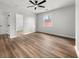 Bright bedroom with hardwood floors and ample natural light from the window at 2670 Thornbury Way, Atlanta, GA 30349