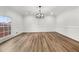 Bright dining room with hardwood floors, neutral walls, and a modern chandelier at 2670 Thornbury Way, Atlanta, GA 30349