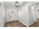 Lovely foyer featuring hardwood floors, white walls, and a decorative front door at 2670 Thornbury Way, Atlanta, GA 30349