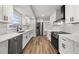 Beautiful kitchen with stainless steel appliances, white cabinets, and ample counter space at 2670 Thornbury Way, Atlanta, GA 30349