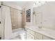 Bathroom featuring a shower-tub combo and white vanity at 3015 Woodvale Ct, Alpharetta, GA 30022