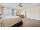 Spacious bedroom featuring hardwood floors, large windows, and a ceiling fan at 3015 Woodvale Ct, Alpharetta, GA 30022