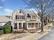 Charming two-story home with stone accents, a covered porch, and neat landscaping at 3015 Woodvale Ct, Alpharetta, GA 30022