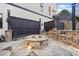 Inviting outdoor space features a stone firepit surrounded by custom stone and dark-stained privacy fencing at 3015 Woodvale Ct, Alpharetta, GA 30022