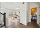 Open-concept living room with hardwood floors and a glimpse of a modern bathroom at 3015 Woodvale Ct, Alpharetta, GA 30022