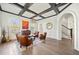 Bright living room with coffered ceiling, hardwood floors, and stylish seating arrangement at 3015 Woodvale Ct, Alpharetta, GA 30022