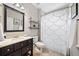 Bathroom featuring a vanity with storage, a toilet and shower with a decorative curtain at 3232 Cates Ne Ave, Brookhaven, GA 30319