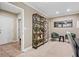 Carpeted bedroom with bookshelf and seating area at 3232 Cates Ne Ave, Brookhaven, GA 30319