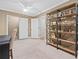 Bedroom with a fan, bookshelf, and entry into another room at 3232 Cates Ne Ave, Brookhaven, GA 30319