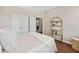 Bedroom with a queen size bed, shelving, and ensuite bathroom entrance at 3232 Cates Ne Ave, Brookhaven, GA 30319