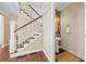 Hallway with staircase and half bathroom with vessel sink and floral wallpaper at 3232 Cates Ne Ave, Brookhaven, GA 30319