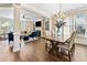 Open-concept living and dining area featuring hardwood floors and lots of natural light at 3232 Cates Ne Ave, Brookhaven, GA 30319