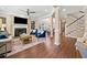 Cozy living room with fireplace, hardwood floors, and an open layout leading to the dining area at 3232 Cates Ne Ave, Brookhaven, GA 30319