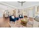 Elegant living room and dining area featuring hardwood floors, stylish furniture, and open layout at 3232 Cates Ne Ave, Brookhaven, GA 30319