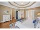 Spacious main bedroom featuring a tray ceiling, sitting area, and ensuite bathroom at 3232 Cates Ne Ave, Brookhaven, GA 30319