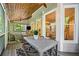 Relaxing screened porch off kitchen/breakfast nook with outdoor table at 3232 Cates Ne Ave, Brookhaven, GA 30319