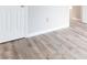 Close-up of modern gray wood flooring with door and gray wall at 602 Granville Ct, Sandy Springs, GA 30328