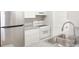 Close-up of a kitchen area, featuring stainless appliances and a stainless steel sink at 602 Granville Ct, Sandy Springs, GA 30328