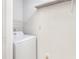 Convenient laundry closet with washer and wire shelving at 602 Granville Ct, Sandy Springs, GA 30328