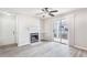 Bright living room featuring a ceiling fan and sliding door, leading to an outdoor space at 602 Granville Ct, Sandy Springs, GA 30328