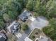 Aerial view of homes on a cul-de-sac surrounded by mature trees and green lawns at 907 Fox Croft Pl, Canton, GA 30114