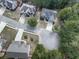 Aerial view of homes on a cul-de-sac surrounded by mature trees and green lawns at 907 Fox Croft Pl, Canton, GA 30114