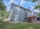 Exterior facade of a house with a well-maintained lawn and a wooden deck with stairs at 907 Fox Croft Pl, Canton, GA 30114