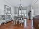 Inviting dining room with hardwood floors, natural light, and stylish furnishings at 907 Fox Croft Pl, Canton, GA 30114