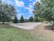 Outdoor sand volleyball court is surrounded by trees, offering a recreational space for community enjoyment at 907 Fox Croft Pl, Canton, GA 30114