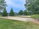 Community sand volleyball courts with lush green lawns and mature trees at 907 Fox Croft Pl, Canton, GA 30114