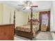 Bedroom features a four-poster bed, carpet, and a chest of drawers at 1600 Yukon Court Ct, Atlanta, GA 30349