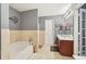 Modern bathroom featuring a soaking tub and dual vanities at 1600 Yukon Ct, Atlanta, GA 30349
